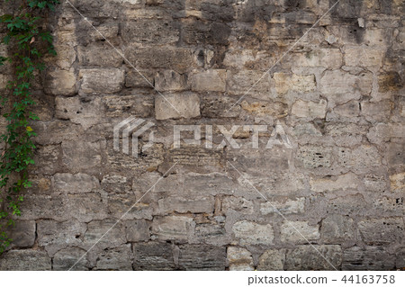 old gray brick wall retro background texture of the stone 44163758