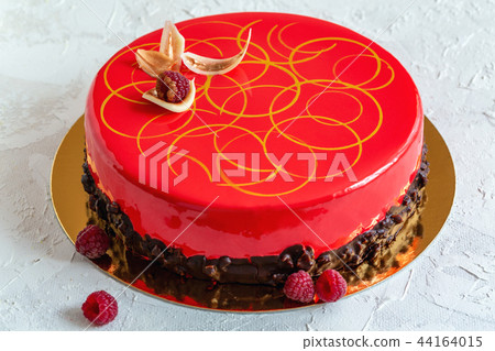 Mousse cake with glaze and chocolate decoration. Mousse cake with glaze and chocolate decoration. 44164015