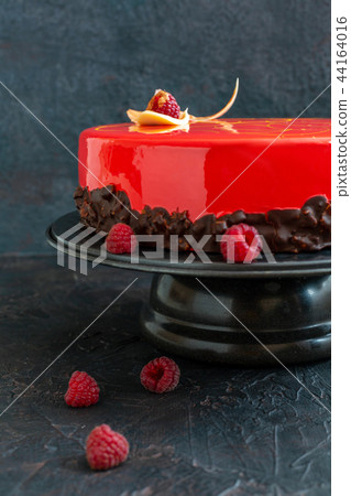 Mousse cake with red mirror glaze. Mousse cake with red mirror glaze. 44164016