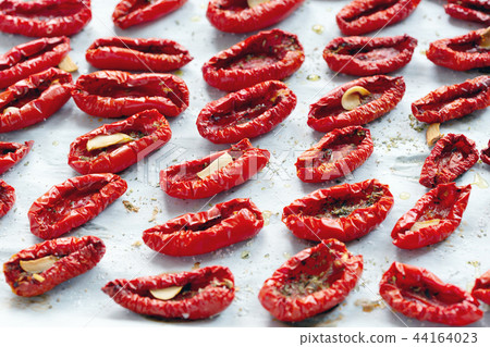 Sun-dried tomatoes with Italian herbs and oil. 44164023