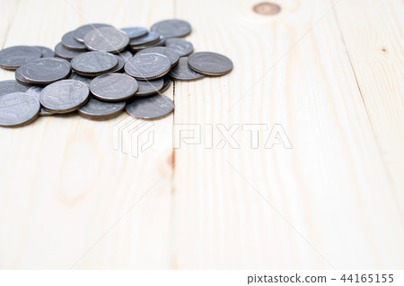coins on wooden background coins on wooden background 44165155