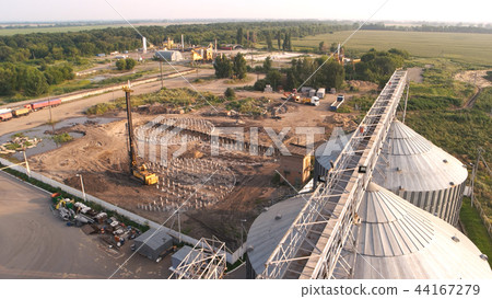 Construction of grain factory at rural location. 44167279