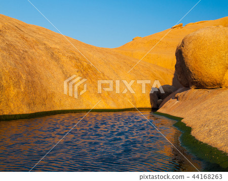 Small water basin in Spitzkoppe rock formation, Namib Desert, Namibia, Africa 44168263