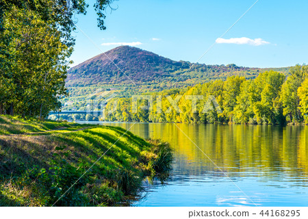 Radobyl Mountain in Ceske Stredohori, Central Bohemian Uplands. View from Labe River in Litomerice Radobyl Mountain in Ceske Stredohori, Central Bohemian Uplands. View from Labe River in Litomerice 44168295