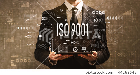 ISO 9001 with businessman holding a tablet computer  44168543