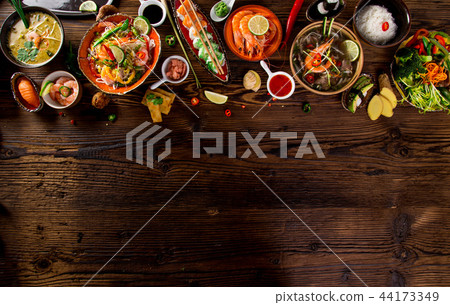 Various of asian meals on rustic background , top view , place for text. Various of asian meals on rustic background , top view , place for text. 44173349