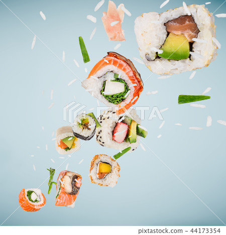 Pieces of delicious japanese sushi frozen in the air. Pieces of delicious japanese sushi frozen in the air. 44173354