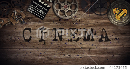 Cinema concept of vintage film reels, clapperboard and projector. Cinema concept of vintage film reels, clapperboard and projector. 44173455