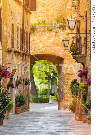 Beautiful street in a small old village Pienza, Tuscany. Beautiful street in a small old village Pienza, Tuscany. 44173458