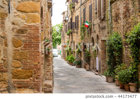 Beautiful street in a small old village Pienza, Tuscany. Beautiful street in a small old village Pienza, Tuscany. 44173477