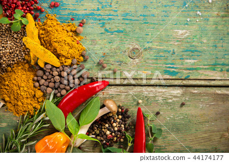 Various colorful spices on wooden table Various colorful spices on wooden table 44174177