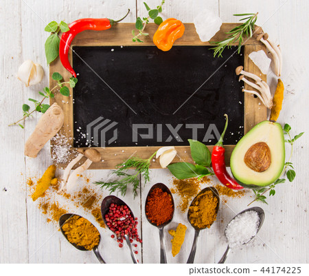 Various colorful spices on wooden table 44174225