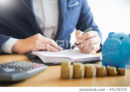 Business accounting man hands working stacking coin the calculat 44176729