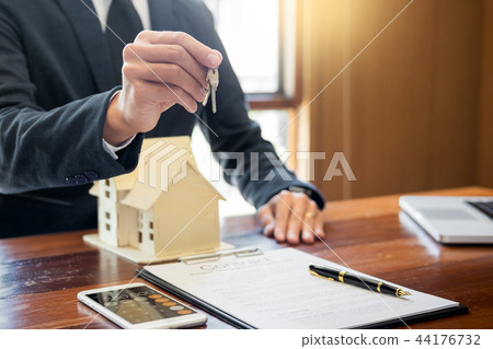 agent getting keys to customer new house, hand of real estate ag 44176732