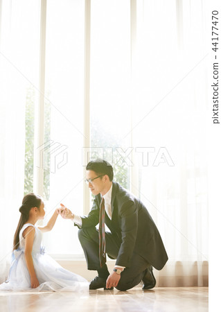 Daughter and father in a dress Daughter and father in a dress 44177470