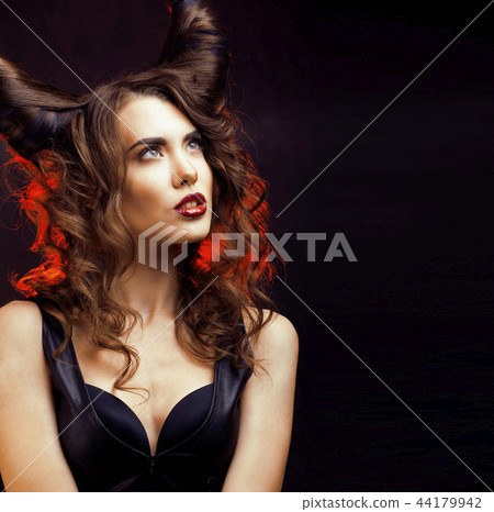 bright mysterious woman with horn hair, halloween celebration 44179942