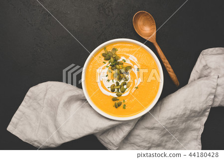 Pumpkin soup with pumpkin seeds and cream Pumpkin soup with pumpkin seeds and cream 44180428