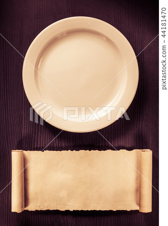 plate and scroll on wood plate and scroll on wood 44181470