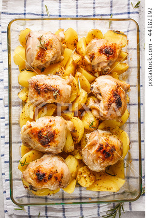 Homemade baked potatoes with chicken in a glass Homemade baked potatoes with chicken in a glass 44182192