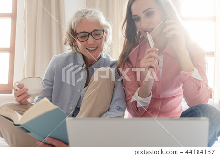 Mother and daughter leading the family business from home  44184137