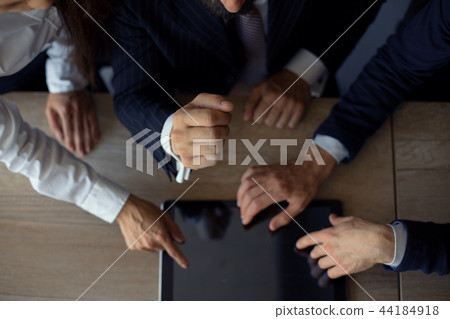 Hand touching tablet in office Hand touching tablet in office 44184918
