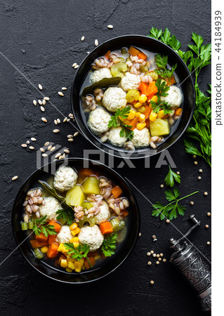 Delicious vegetable soup with chicken meatballs Delicious vegetable soup with chicken meatballs 44184939