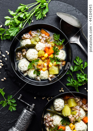 Delicious vegetable soup with chicken meatballs 44184945