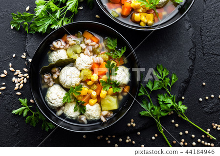 Delicious vegetable soup with chicken meatballs Delicious vegetable soup with chicken meatballs 44184946