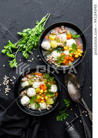 Delicious vegetable soup with chicken meatballs Delicious vegetable soup with chicken meatballs 44184949