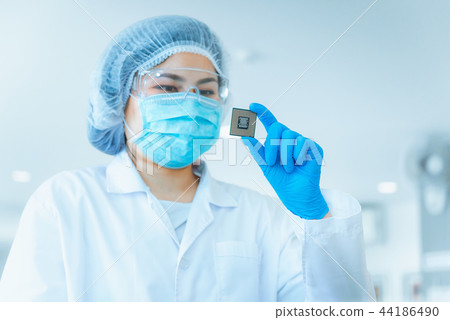 Portrait of computer engineer is holding CPU Portrait of computer engineer is holding CPU 44186490