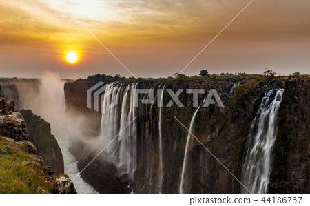Victoria falls dreamy sunset panorama with orange 44186737
