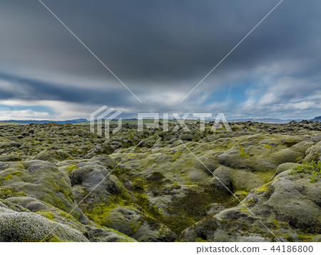 Never-ending Lava fields in Iceland with mountains, long exposure 44186800