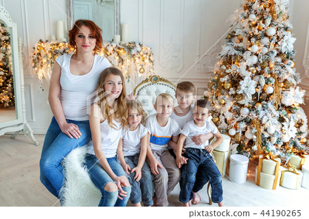 Mother and five children near Christmas tree at home 44190265