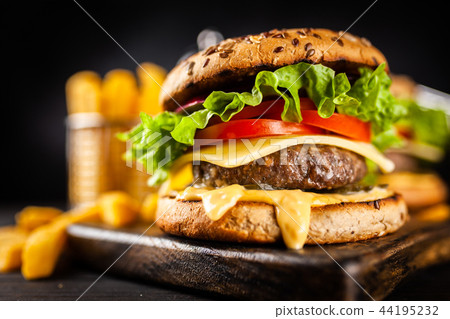 Delicious grilled burgers 44195232