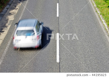 An overhead view of a car running through An overhead view of a car running through 44195823