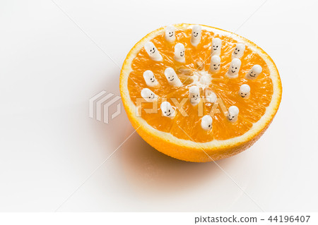 Funny capsules with vitamins from half an orange. Funny capsules with vitamins from half an orange. 44196407