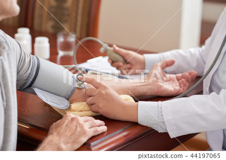 Checking blood pressure 44197065