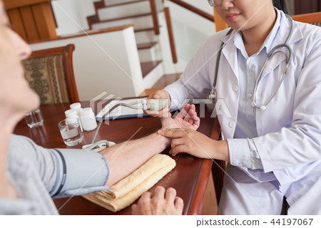 Checking blood pressure 44197067