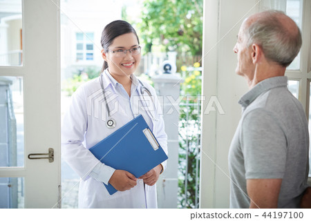 Doctor visiting patient Doctor visiting patient 44197100