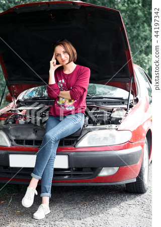young girl with the red car young girl with the red car 44197342