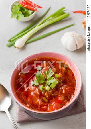 Borsch, beetroot soup in a wooden bowl with fresh Borsch, beetroot soup in a wooden bowl with fresh 44197485