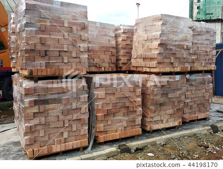 Stock pile of clay brick on wooden pallets Stock pile of clay brick on wooden pallets 44198170