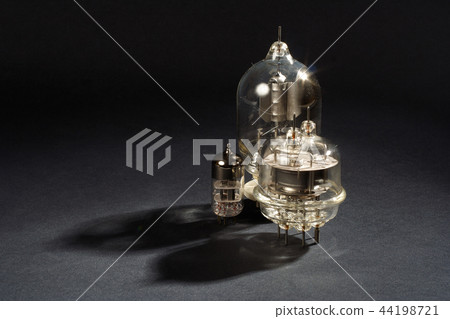 old vacuum tube on black background 44198721