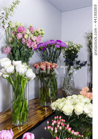 Colorful different flowers in vase at flower shop 44198869