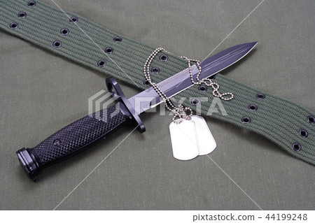 M16 rifle bayonet on uniform background M16 rifle bayonet on uniform background 44199248