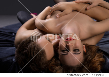 Beautiful nude couple wrapped in steamy embrace Beautiful nude couple wrapped in steamy embrace 44199310