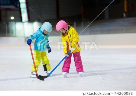 Children play ice hockey. Kids winter sport. 44200088