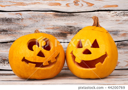 Funny Halloween pumpkins on wooden background. Funny Halloween pumpkins on wooden background. 44200769