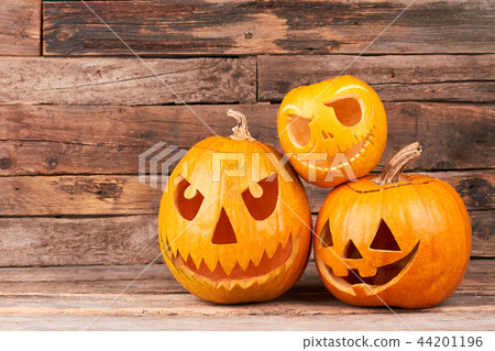 Three Halloween pumpkin heads at sunlight. 44201196