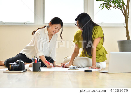 Two women colleagues in creative work Two women colleagues in creative work 44201679
